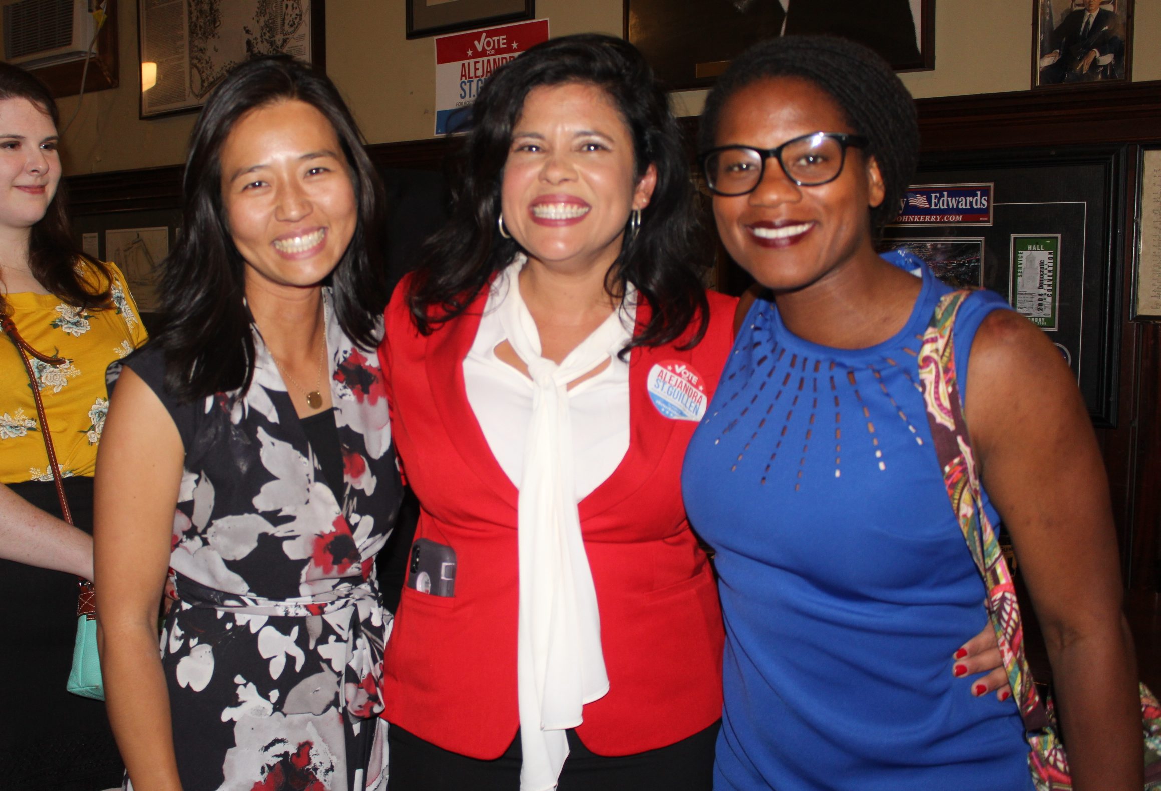 Alejandra St. Guillen (center) at her post-election party with fellow candidates Michelle Wu (left) and councilor Lydia Edwards (right). Photo by Alexa Gagosz.