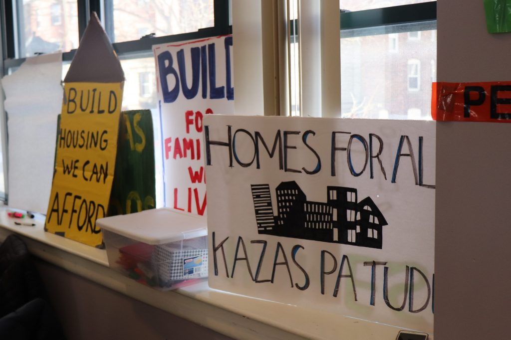 Protest signs at the people's assembly in Fields Corner. Photo by Eileen O'Grady.