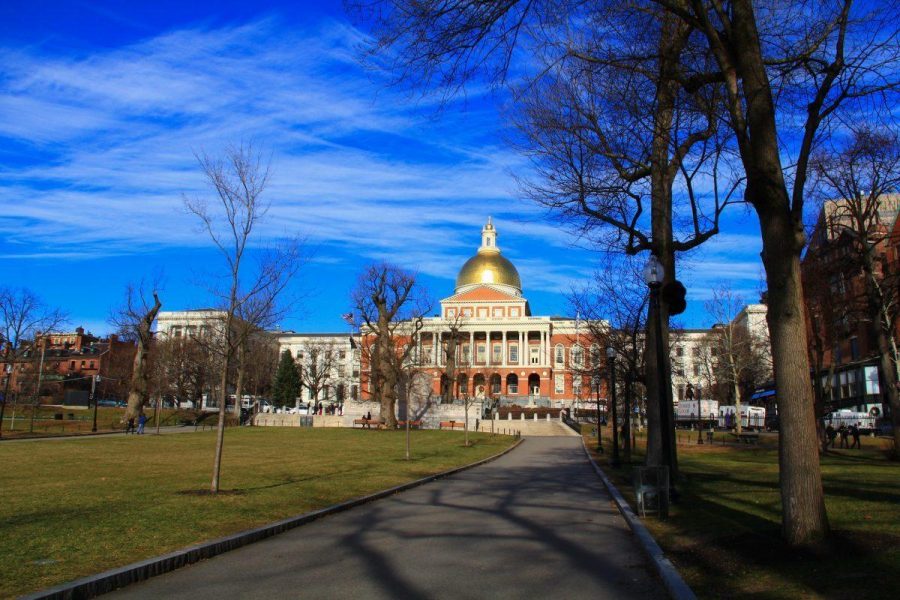 The Massachusetts state capitol building on beacon hill, taken from a distance in boston common