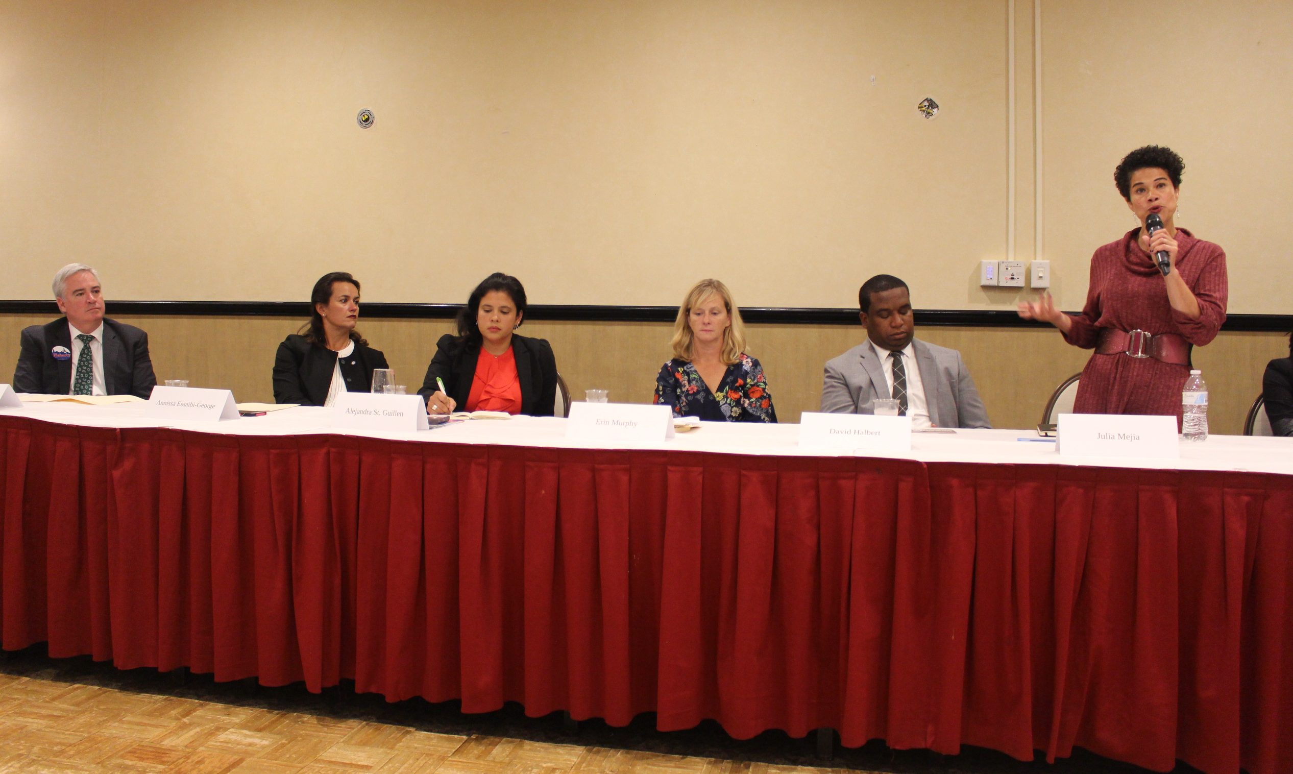 (From left to right) At-large City Councilor candidates, Councilor Michael Flaherty, Councilor Annissa Essaibi-George, Alejandra St. Guillen, Erin Murphy, David Halbert, Julia Mejia and Councilor Michelle Wu, met on Tuesday, Oct. 1 at Florian Hall to discuss voters issues. Photo by Alexa Gagosz.