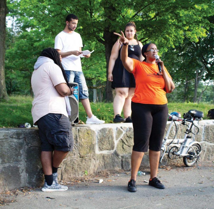 Monica Cannon-Grant leads an anti-violence demonstration in Franklin Park in August 2018. Photo by Catherine McGloin.