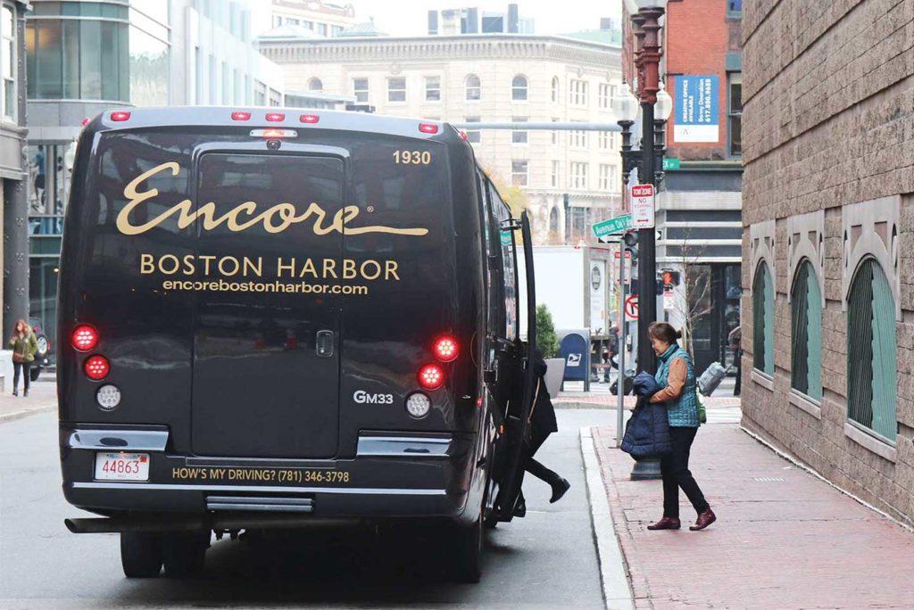Shuttle buses such as this one from Encore Casino regularly pick up customers from Chinatown and other low-income communities. Photo by Eileen O’Grady.