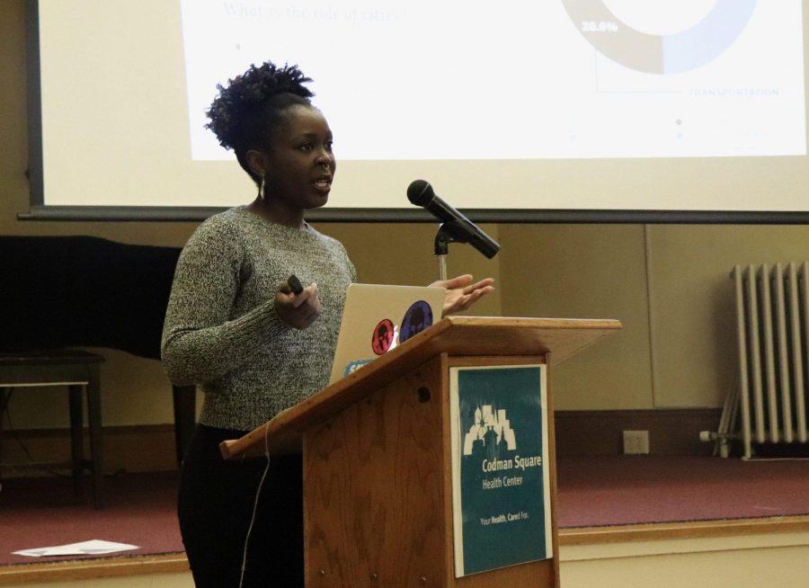 Sharon Amuguni, a facilitator of the discussion on climate change last week, speaking to the community members gathered at Codman Square Health Center. Photo by Eileen O'Grady.