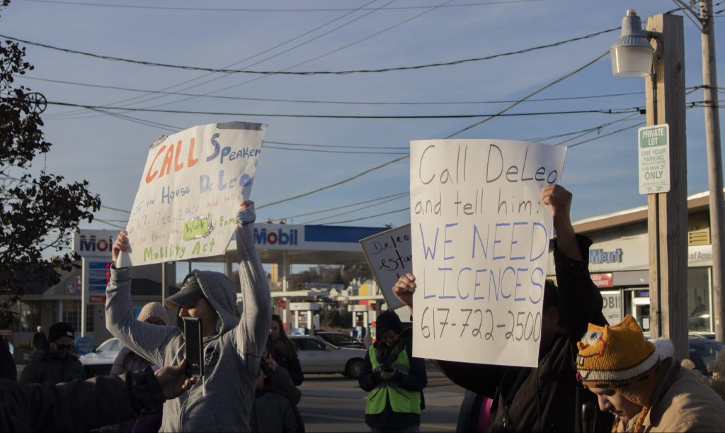 Activists for securing driver's licenses for undocumented immigrants march in Winthrop. Photo by Elizabeth Torres.