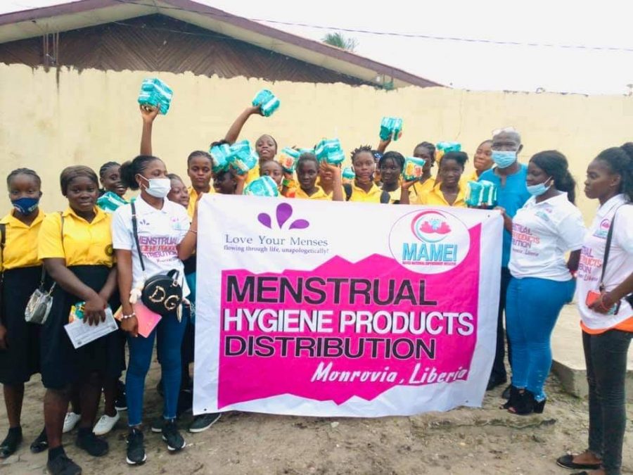 A group of girls in Liberia receiving care kits with menstruation products from 'Love Your Menses.' Photo courtesy: 'Love Your Menses.'