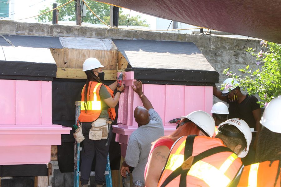 Trainees working with Thomas in a project at The People's Academy. Photo courtesy: The People's Academy.