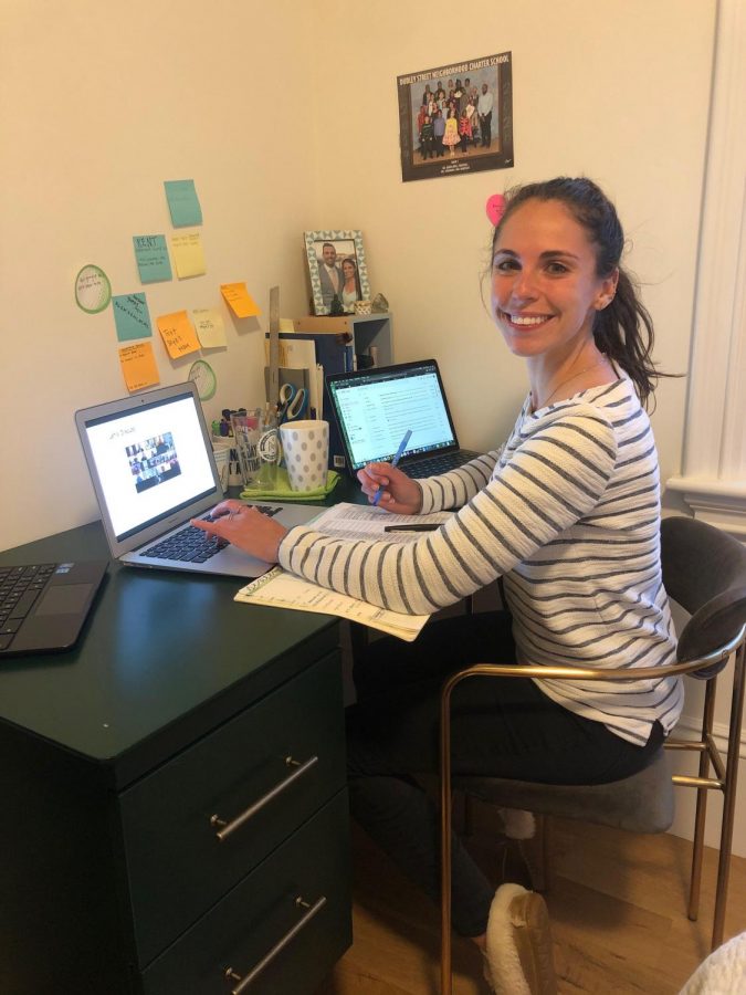 Julia Goodman, who fundraised the traveling library for her second graders, at her desk during a virtual class.