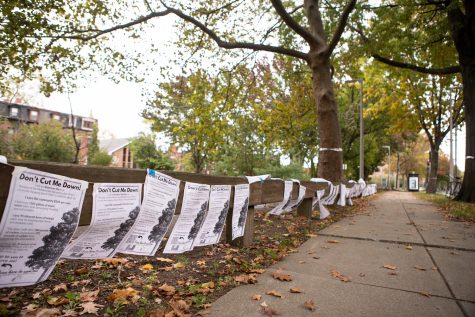 Posters with messages objecting the removal of trees on Melnea Cass.