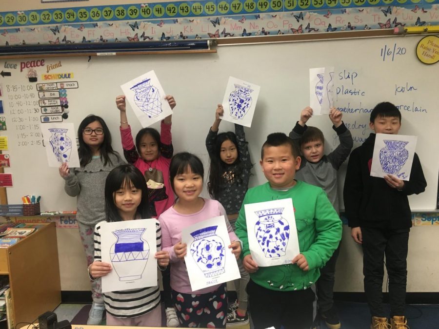 Students make Chinese blue and white porcelain artwork in a class at the the Chinese Culture Connection center, photo taken before COVID-19.