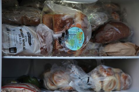 The fridge’s freezer is stocked with a wide array of baked goods — bagels, rolls and loaves of bread.