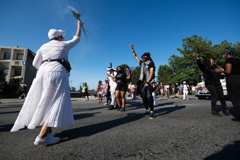 The Say Her Name March and Rally, with eventually more than 1,000 people in attendance, begins it's departure from Nubian Square in Roxbury toward the Boston Common on July 4. Members of the Sistahs of Calabash