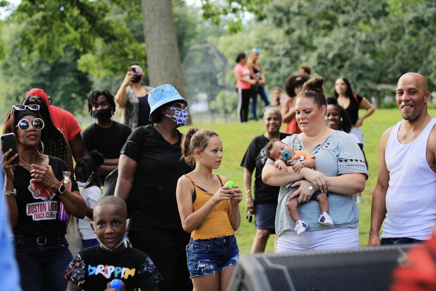Families gather near the stage waiting for performances to start at the 11th annual Back to School Block Party Event at Franklin Park on Saturday, August 21, 2021. 