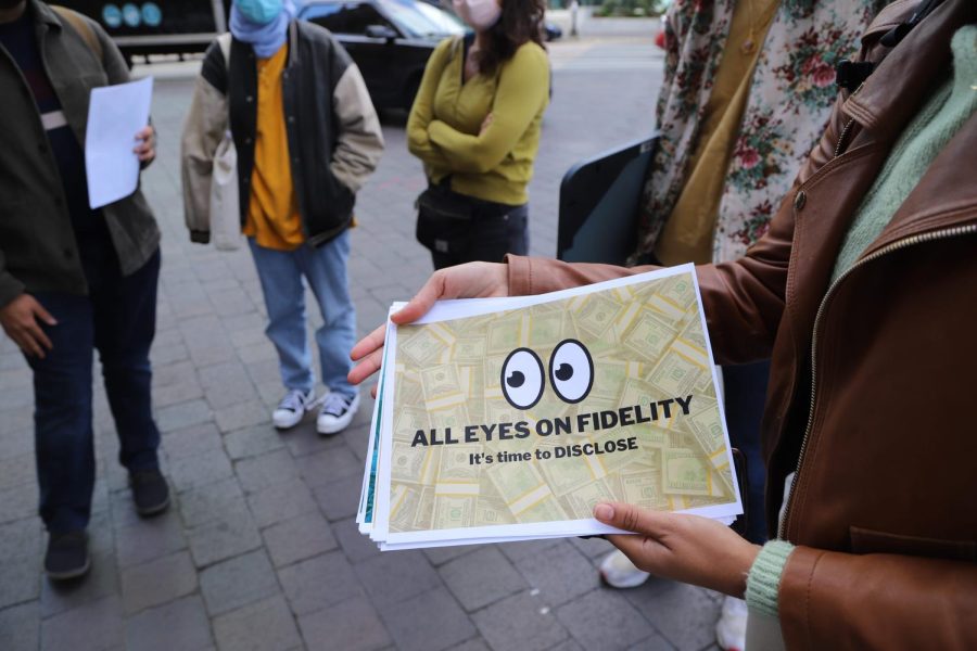 Members of Unmasking Fidelity coalition gather with signs and letter near Fidelity Investments’ headquarters on September 30th, 2021. 