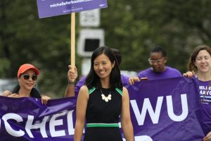 Mayor Wu, who was at the time a mayoral candidate and City Councilor, walks with volunteers at the Roxbury Unity Day Parade on July 18, 2021. A large part of her campaign was progressive climate policies. 