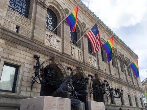 Photo of the LGBTQIA flag outside of the Boston Public Library. 