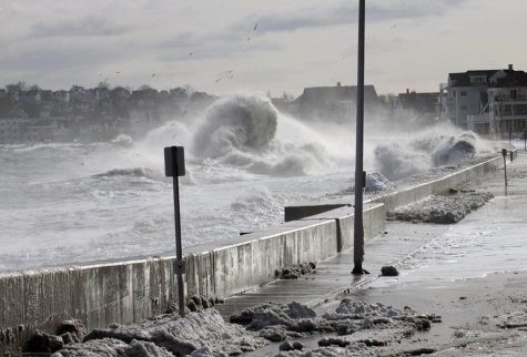 Waves seen climbing higher than normal and spilling on to Route 145, which runs through East Boston to Winthrop, on Winthrop Parkway.