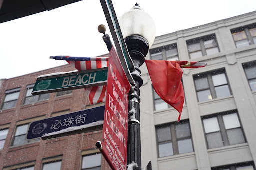 A bilingual sign seen on Beach Street, one of the main streets in Chinatown, Boston. The bilingual signs translate by pronounciation. 