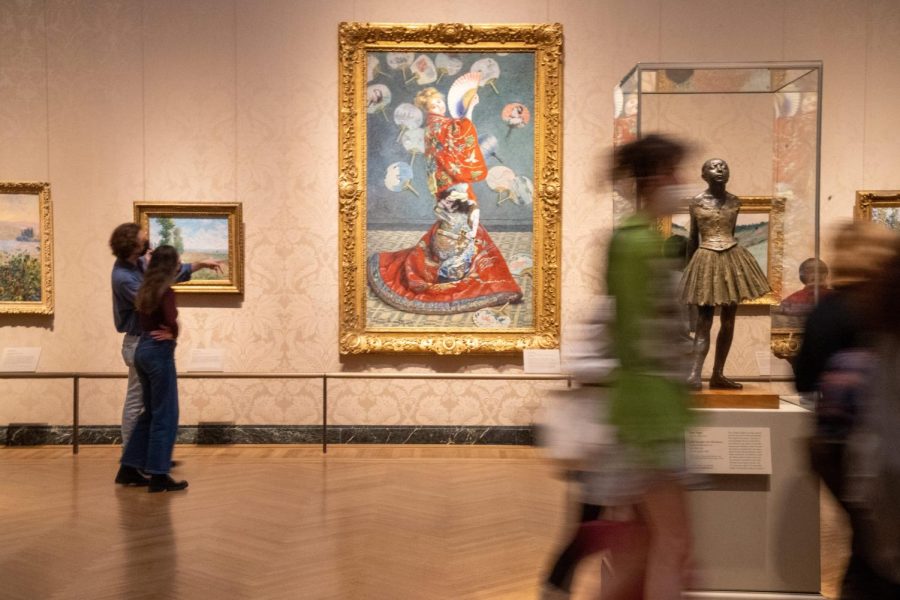Museum of Fine Arts Boston visitors view La Japonaise (Camille Monet in Japanese Costume), a large-scale figure portrait of the artists wife painted in the Impressionist style by Claude Monet in 1876. The painting also makes references to Orientalism, a growing movement within 19th century society, where Eastern people and cultures were depicted based on how white Europeans imagined them to look. Oriental subjects became so popular that a French Society of Orientalist Painters was founded in 1893.