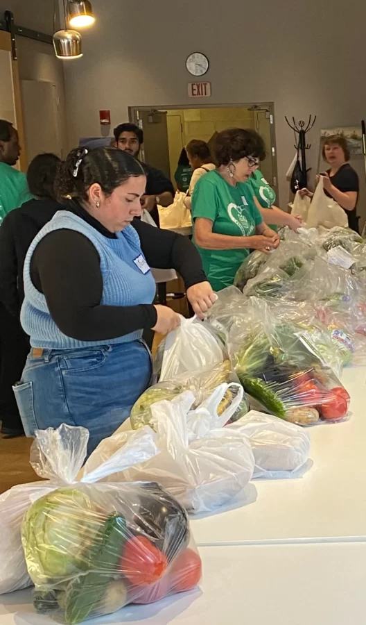 FCC volunteers, many of whom are students, bag groceries