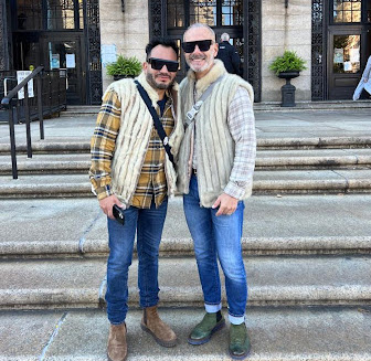 Couple Raul Soikes, 60, and Louis Rojas, 50, cast their ballots on Tuesday at Copley Library