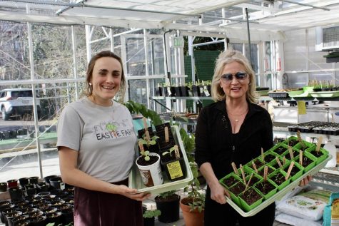 Jenny Wechter (left) and Heather OBrien (right) pose with students plants at the Eastie Farm greenhouse. Photo: Cassidy McNeeley