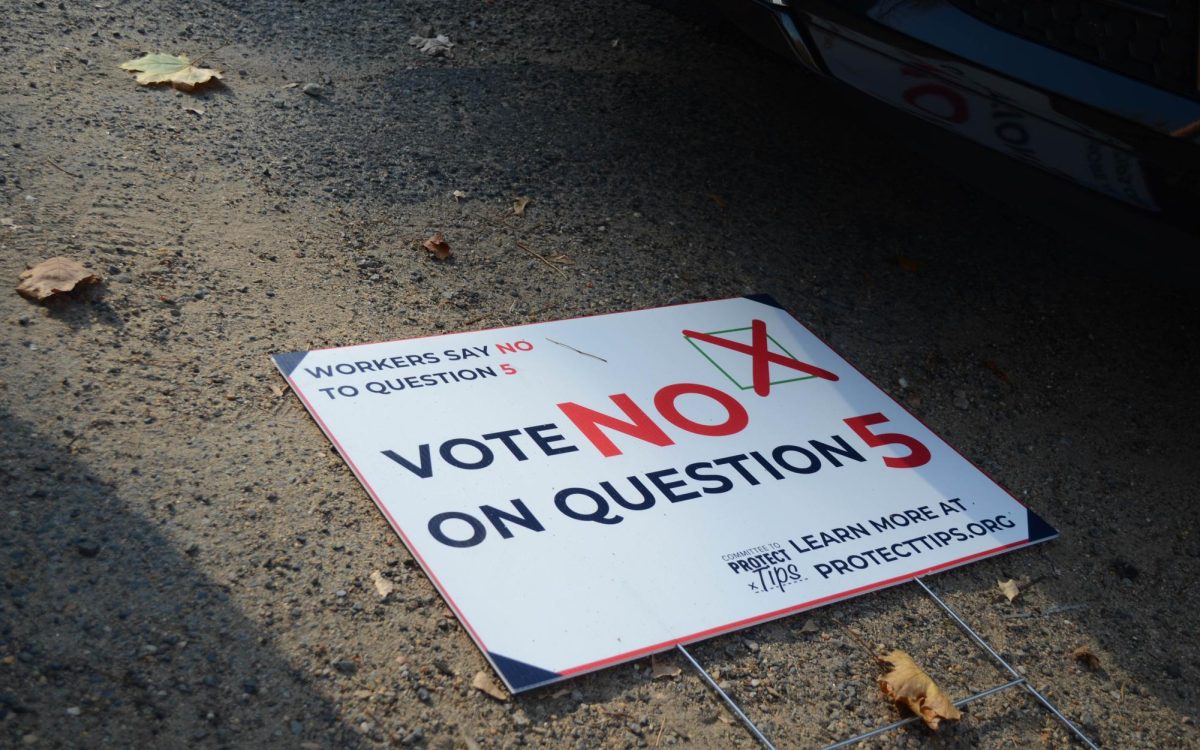 A sign telling Massachusetts voters to vote "no" on Question 5, which asks residents if they'd like to raise the minimum wage for tipped workers. 