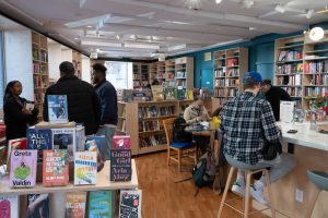 Customers mingle and read at Dorchester's new literary gathering space justBook-ish. 