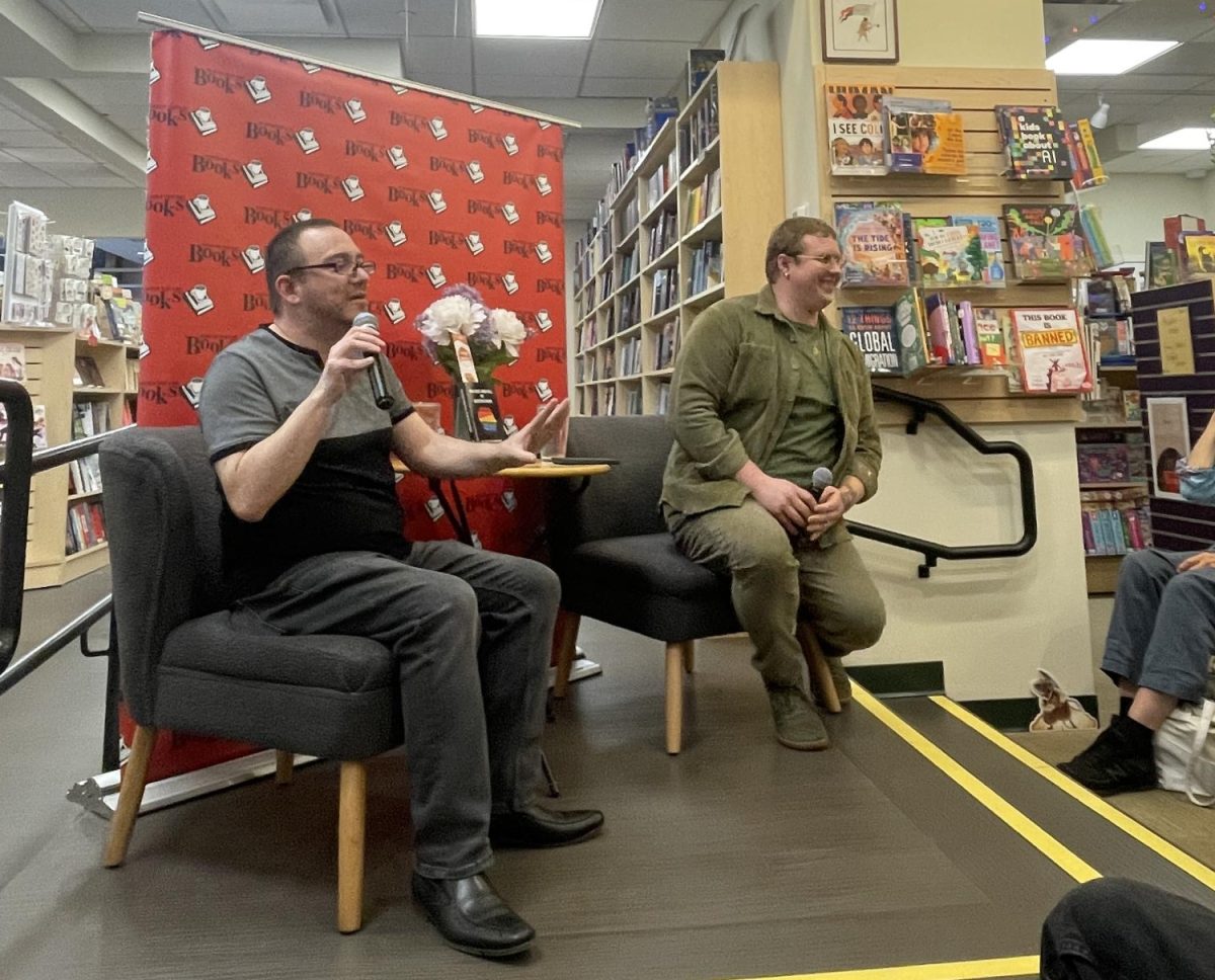 Author Daniel Gonzalez (left) speaks about his book "The Rise and Fall of Boston Pride" with moderator Matisse DuPont at Porter Square Books.
