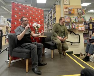 Author Daniel Gonzalez (left) speaks about his book "The Rise and Fall of Boston Pride" with moderator Matisse DuPont at Porter Square Books.
