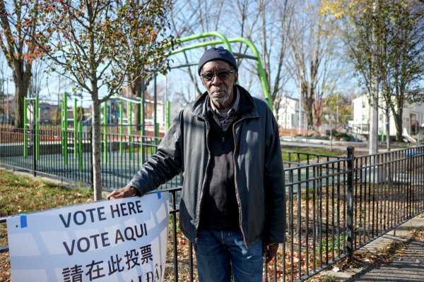 Nov. 5, 2024 — Phillip Mayo stands outside the John Winthrop Elementary School in district 13-2 where he has been the warden for over 20 years. 