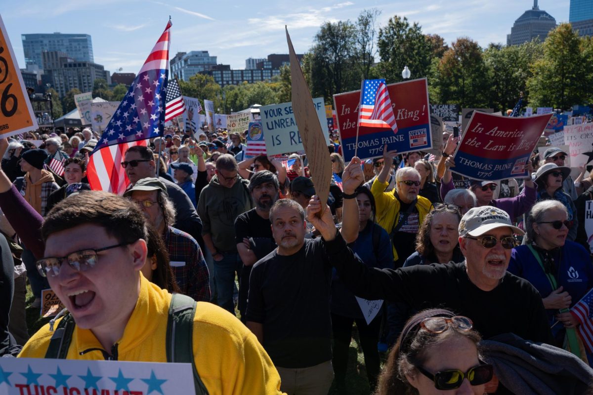 Protesters shout alongside BVOCAL, a protest chorus known for energizing rallies with song.