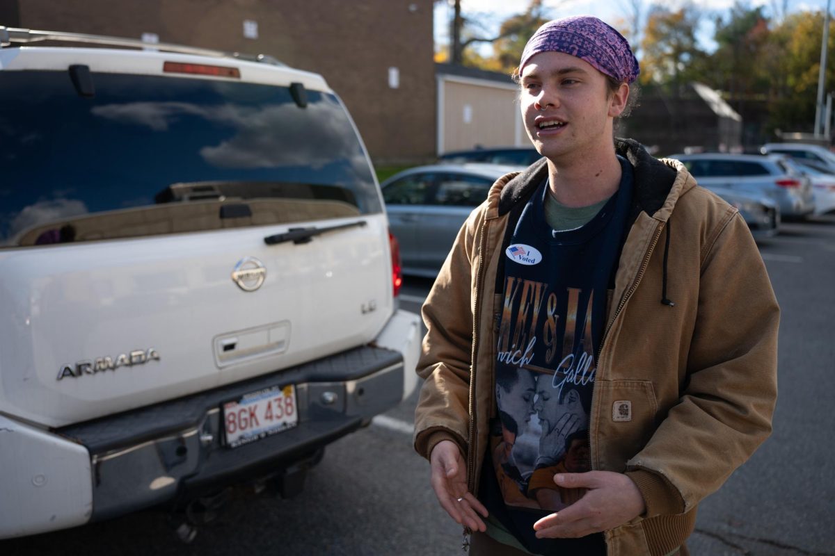 Shortly after voting, Henry Madten stands in the parking lot of the Yawkey Club of Roxbury. 