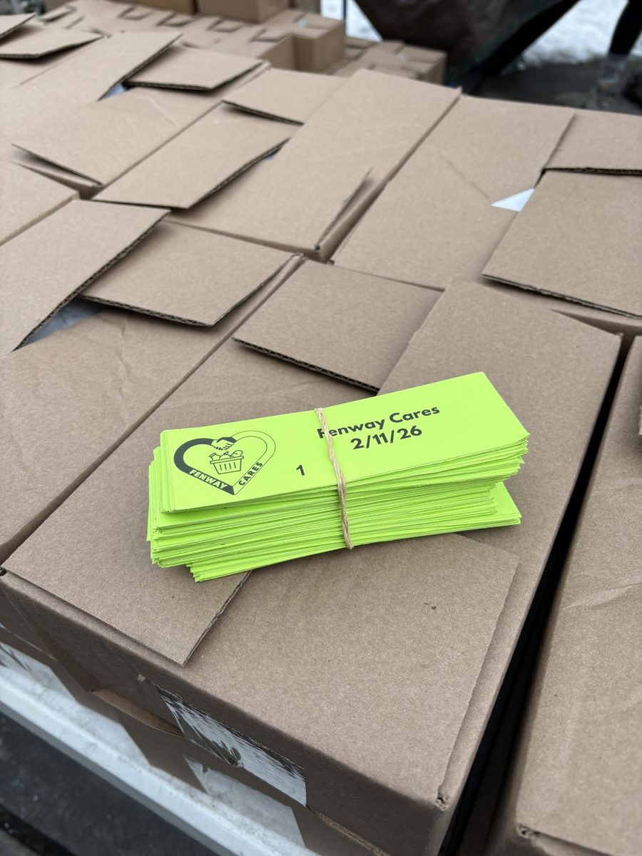 Tickets for food distribution recipients rest on produce boxes at Symphony Community Park in Fenway on Feb. 11.