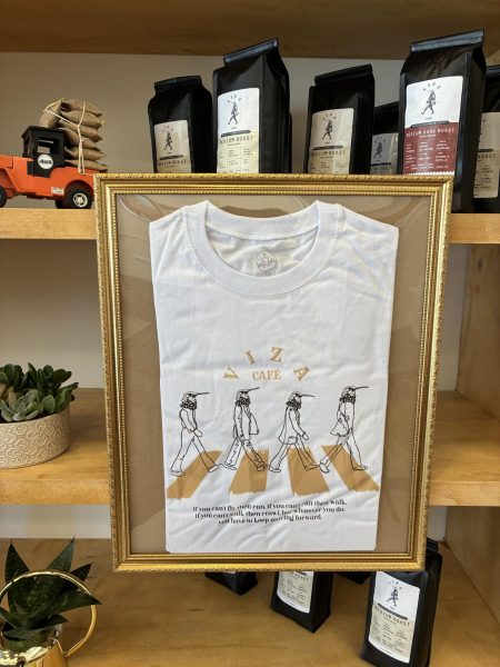 Viza Cafe's logo features a figure with the body of a man and the head of a hummingbird.
