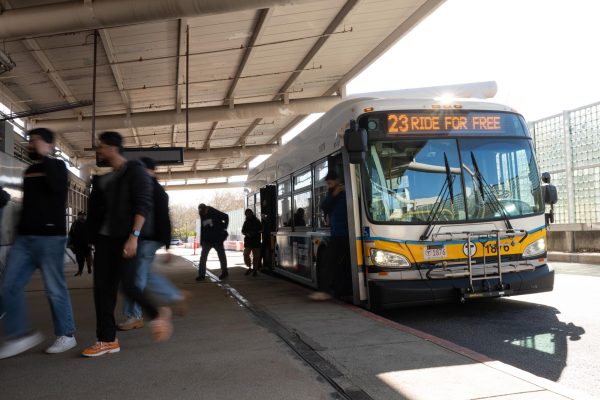 A MBTA bus on Route 23 displays "Ride For Free" on its electronic front sign.